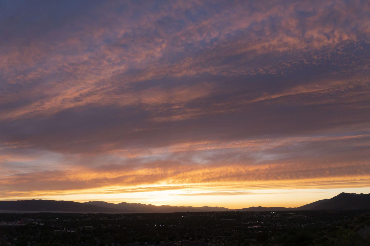 A sunset with many colors and depths out over the mountains to the west